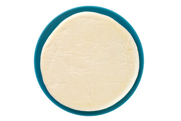 Cheese on a plate on a white background. Cheese closeup on a white background. Top view.
