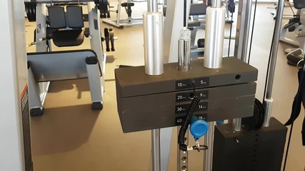 Weight on a sports machine simulator, in motion.