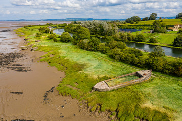 Aerial view of abandoned hulls of boats at the Purton Hulks (Ship Graveyard)