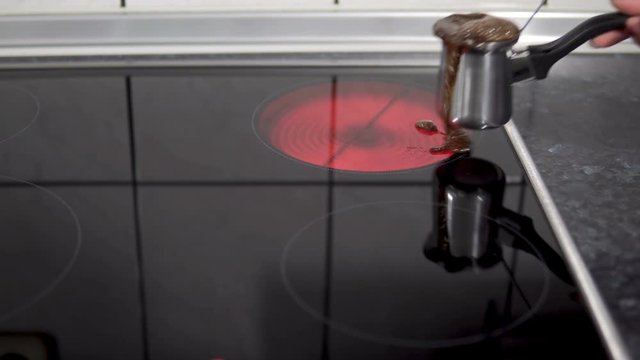 Cooking turkish coffee in copper cezve on modern electric stove