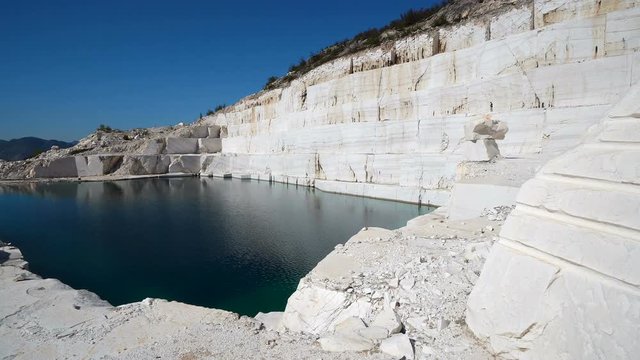 An abandoned marble quarry and a lake pamukkale in the middle of the quarry