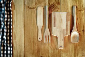 Kitchen tools and utensils on wooden board. Copy space for text, products and decorations.
