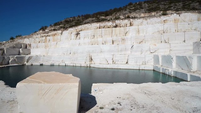 Large marble blocks in open mine with formation of marble lake pamukkale in Macedonia