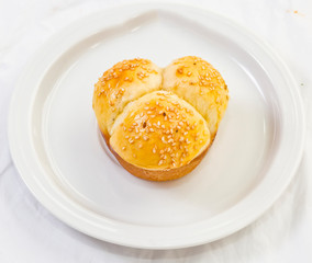 Soft No-Knead Heart shaped Buttery Dinner Rolls with Sesame seeds.