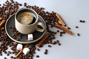 Ceramic coffee Cup, cinnamon and sugar on light background