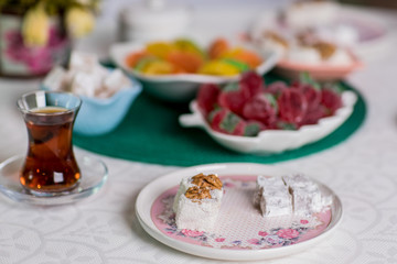 tea table. on the table are baklava, lokum, marmalade, and other sweets