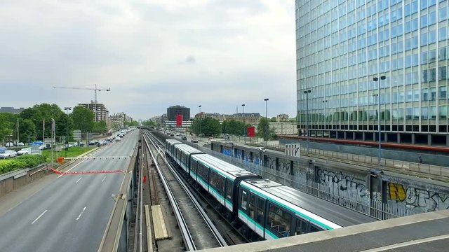 Traffic on highway, roads and metro rails at financial business district La Defense in Paris, France