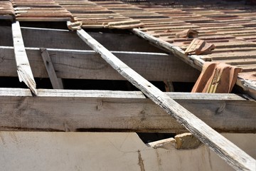 Detail of damaged tile roof due to breakage of the support structure