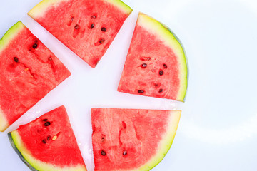 Sliced watermelon on a white background, background and texture of ripe juicy watermelon.