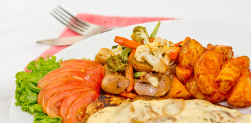 Peri peri Chicken with Button mushroom gravy, Saute Vegetables, Spicy fried Potatoes with Tomato Lettuce Salad.