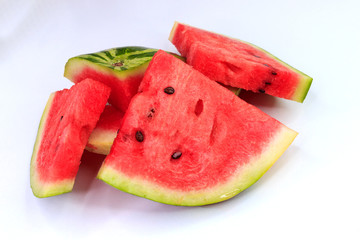 Sliced watermelon on a white background, background and texture of ripe juicy watermelon.