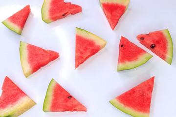 Sliced watermelon on a white background, background and texture of ripe juicy watermelon.