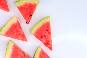 Sliced watermelon on a white background, background and texture of ripe juicy watermelon.
