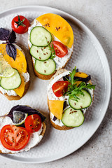 Sandwiches with cream cheese and vegetables.