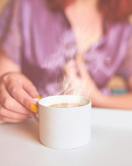Woman drink coffee in bed