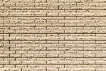 Close-up detail of a sand brick wall texture for background. Horizontal masonry.