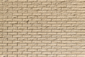 Close-up detail of a sand brick wall texture for background. Horizontal masonry.