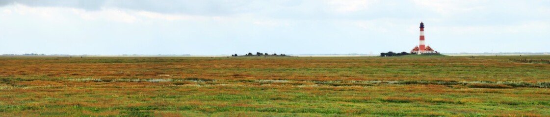 Obraz premium Rund um den Leuchtturm Westerheversand – der Nationalpark Wattenmeer