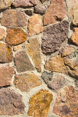 Decorative masonry from large stones background. Close-up detail view.