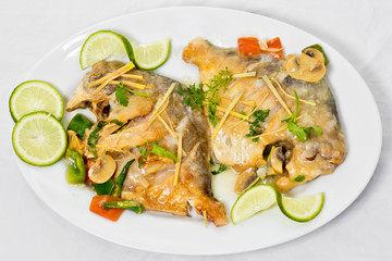 Pomfret fish pieces on plate, spicy Indian dish. Popular amongst Bengalis and south Asia for it's taste.
