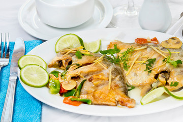 Pomfret fish pieces on plate, spicy Indian dish. Popular amongst Bengalis and south Asia for it's taste.