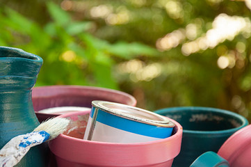 Close up_painted_flower pots and jug_brush_1 paint pot_green background__by jziprian