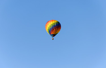 Colorful hot air balloon in the blue sky.