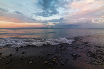 Fototapeta premium Beautiful sunrise on the lake. Fantastic sunrise colorful clouds on on the Sevan like Armenia.