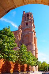 Bell tower of the superb Sainte Cécile cathedral built in red brick on the river Tarn in Albi in Occitanie (South of France) - Free entrance