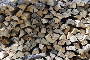 The texture of a folded firewood raspberry. Wood for the fireplace.