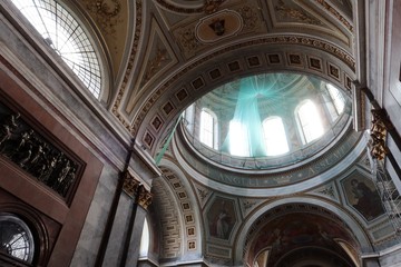 Upward view on round dome and roof of Primatial Basilica of the Blessed Virgin Mary Assumed Into Heaven and St Adalbert in Esztergom. Green protective network used during restoration visible.