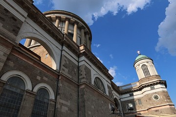 North wall of Primatial Basilica of the Blessed Virgin Mary Assumed Into Heaven and St Adalbert, main dome and side tower visible. 