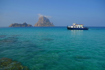 Es Vedra. Ibiza. Spain - 26 may 2018. Water taxi (boat) near the mystical island