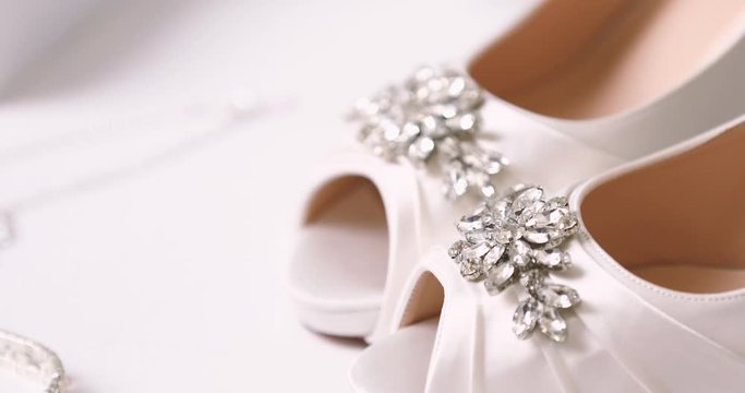 Bride dresses wedding shoes. wedding decorations close-up 4k