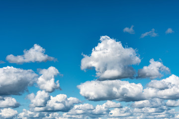 White, Fluffy Clouds In Blue Sky. Abstract Background From Clouds.