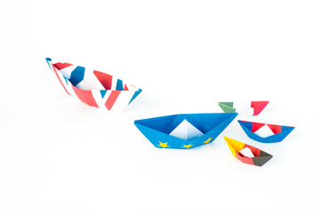 paper ships from the flags of the European Union and the UK and other countries of europe on white background, concept of an agreement on Brexit