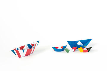 paper ships from the flags of the European Union and the UK and other countries of europe on white background, concept of an agreement on Brexit