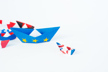paper ships from the flags of the European Union and the UK and other countries of europe on white background, concept of an agreement on Brexit