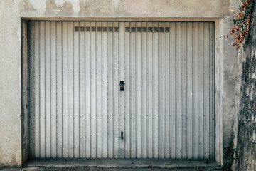 isolated old looked garage with cracked wall for texture or background