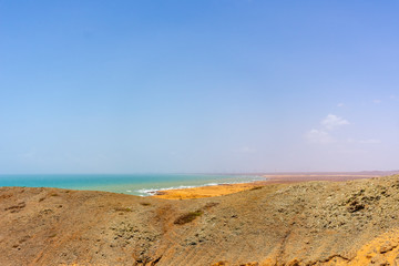 Fototapeta na wymiar Landscape of desert of Cabo de la Vela, La Guajira, Colombia with the caribbean sea of background