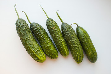 vegetarian green cucumbers on a white background