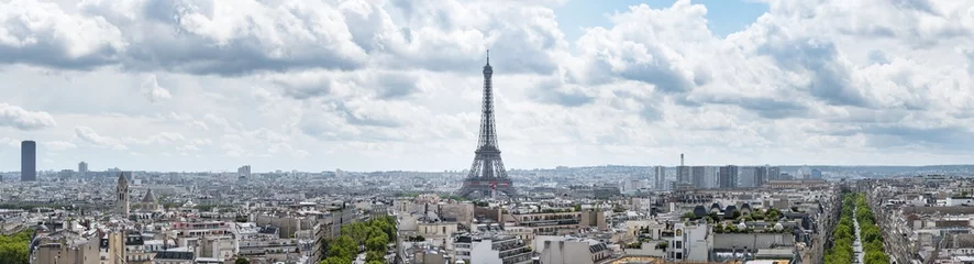 Zelfklevend Fotobehang Large panoramic cityscape of Paris, France, with the Eiffel Tower centred in the image under a dramatic cloudy sky. © RichHiggins