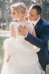 Happy bride and groom on their wedding in garden