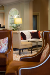 Cozy and elegant foyer area with retro-style armchairs	