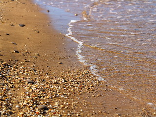 sand and pebbles on the beach texture background