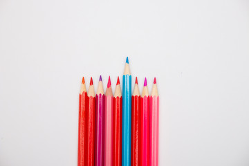 color pencils metaphor gender relations between men and women boys and girls place copy white background isolation top view pink red blue LGBT love friendship