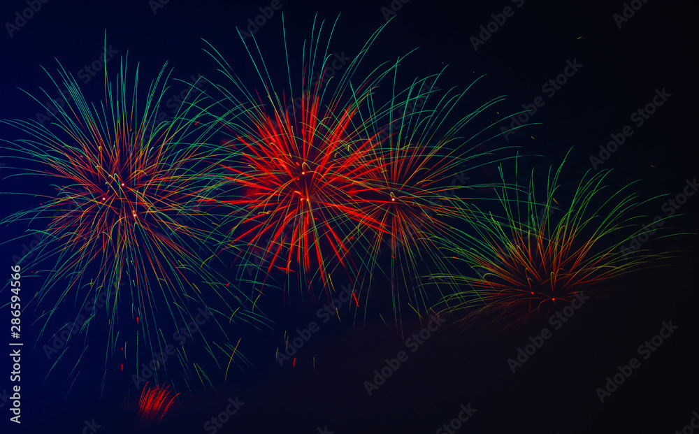 Wall mural colorful fireworks in night sky