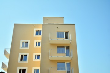 Modern apartment buildings on a sunny day with a blue sky. Facade of a modern apartment building