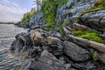 Highly contorted multi-banded gneiss along the shore of an island in the Georgian Bay, Ontario.