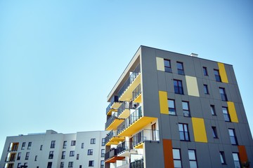 Modern apartment buildings on a sunny day with a blue sky. Facade of a modern apartment building